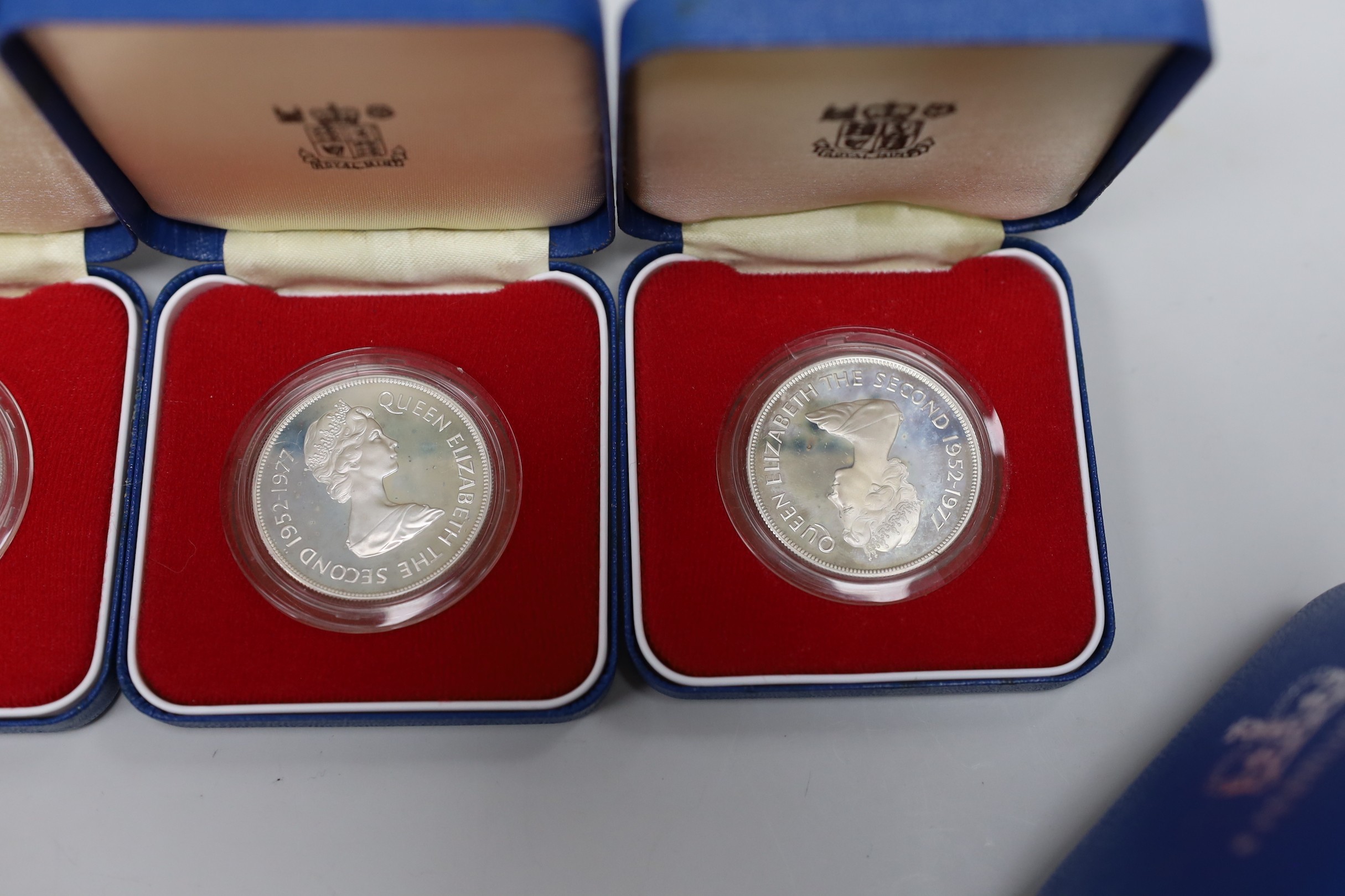 Eleven Royal Mint Commonwealth commemorative proof silver crowns